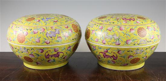 A pair of Chinese famille rose yellow ground boxes and covers, second half 19th century, 24.5cm diam.